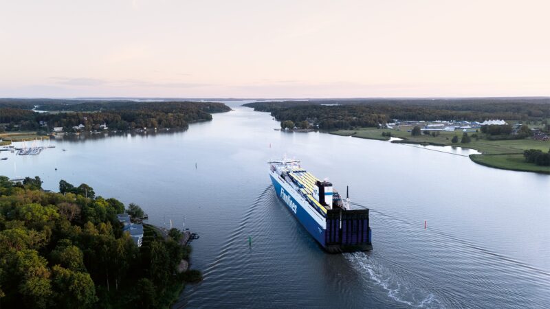 Finnlines vessel full of cargo sailing in the calm channel in the archipelago